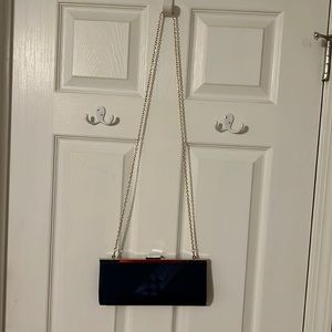 Navy blue purse. Satin. Can be used with or without the gold chain